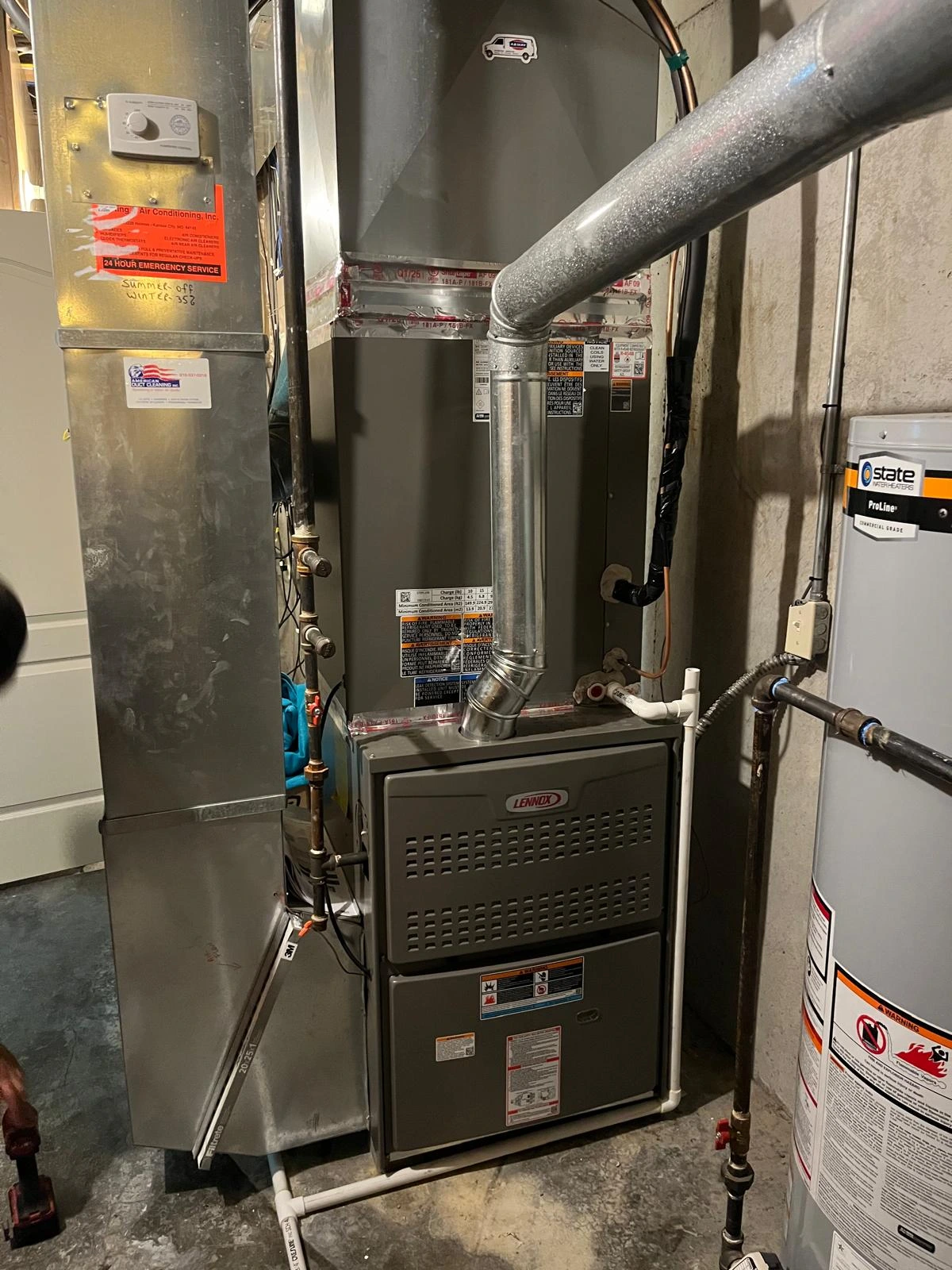 Lennox gas furnace system installed alongside a water heater unit